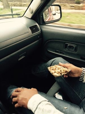Said individual holding peanut remnants. Photo by author, taken at a red light. Said individual holding peanut remnants. Photo by author, taken at a red light.